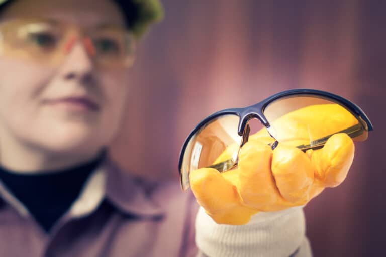 Woman worker with safety glasses