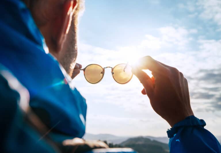 Backpacker man with sunglasses outside