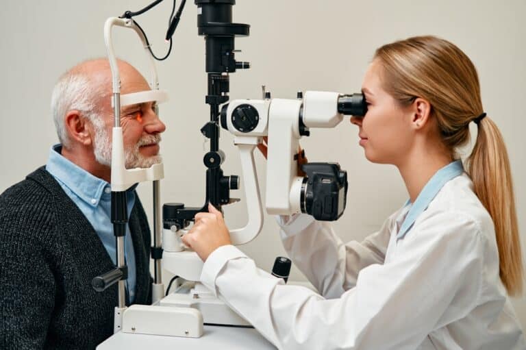 Older man having his eyes examined