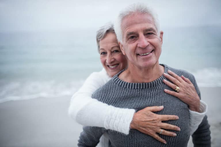 Happy couple by the ocean